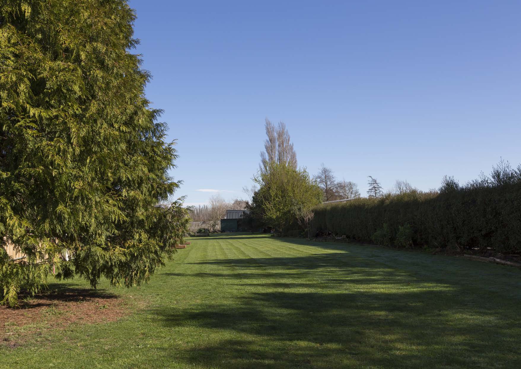 Private lawn and established screening beyond the entrance